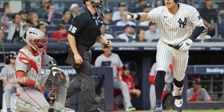 Anthony Volpe points to the Yankees' dugout after hitting a solo home run in the second inning of the Yankees' 3-1 loss to the Red Sox in Game 1 of their AL wild-card series on Sept. 30, 2025.