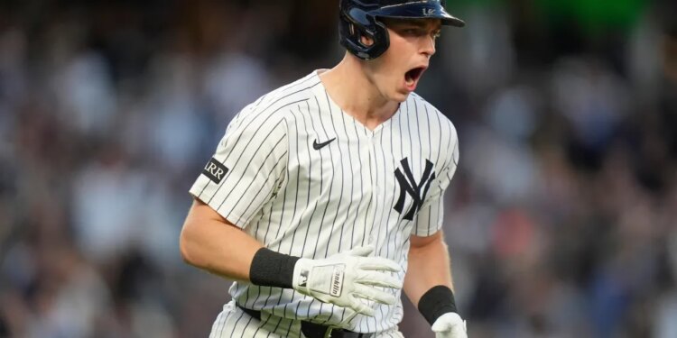 New York Yankees first base Ben Rice reacts after hitting a two-run home run against the Boston Red Sox during the first inning of Game 2 of an American League wild-card baseball playoff series, Wednesday, Oct. 1, 2025, in New York.