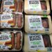 Packages of Beyond Meat's Beyond Burgers and Beyond Sausage on a shelf.