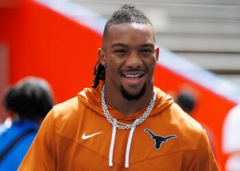 Atlanta Falcons running back Bijan Robinson (7) smiles on the field.