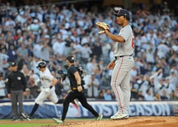 Brayan Bello on the mound as Ben Rice rounds the bases.