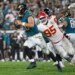 Jacksonville Jaguars quarterback Trevor Lawrence (16) gets past Kansas City Chiefs defensive tackle Chris Jones (95) as he runs the ball during the second half of an NFL football game, Monday, Oct. 6, 2025, in Jacksonville, Fla.