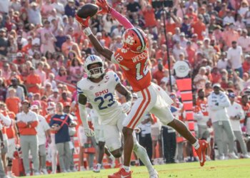 Clemson Tigers wide receiver Bryant Wesco Jr. attempts to catch a pass while Southern Methodist Mustangs safety Isaiah Nwokobia defends.