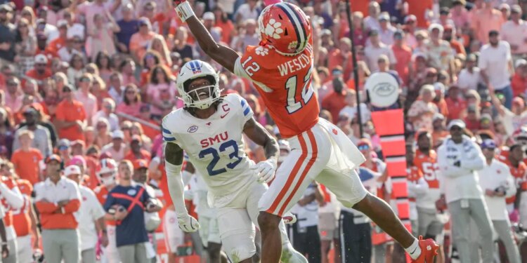 Clemson Tigers wide receiver Bryant Wesco Jr. attempts to catch a pass while Southern Methodist Mustangs safety Isaiah Nwokobia defends.