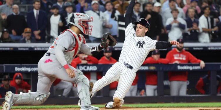 Cody Bellinger #35 of the New York Yankees scores on Amed Rosario #14 of the New York Yankees RBI single during the fourth inning.
