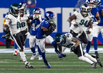 Wan'Dale Robinson (17) is tackled by Philadelphia Eagles Marcus Epps in the second half at MetLife Stadium Thursday, Oct. 9, 2025, in East Rutherford, NJ.