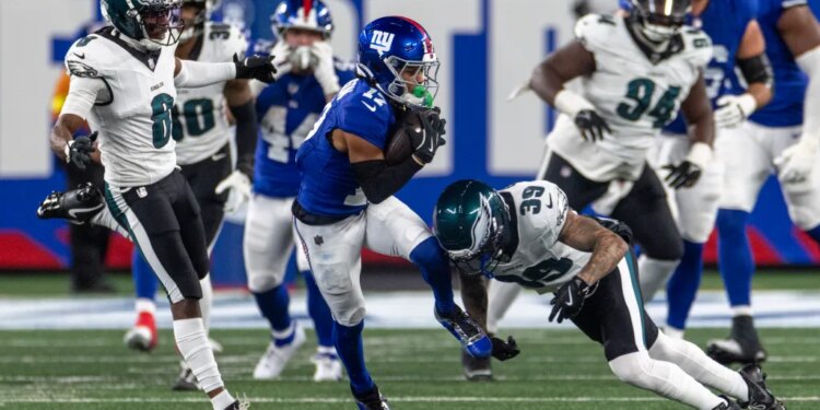 Wan'Dale Robinson (17) is tackled by Philadelphia Eagles Marcus Epps in the second half at MetLife Stadium Thursday, Oct. 9, 2025, in East Rutherford, NJ.
