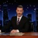 Jimmy Kimmel sits at his desk on the set of "Jimmy Kimmel Live!"