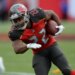 Doug Martin running with the football.