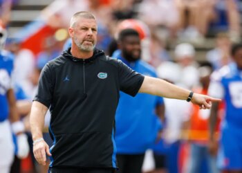 Florida Gators coach Billy Napier pointing on the field.