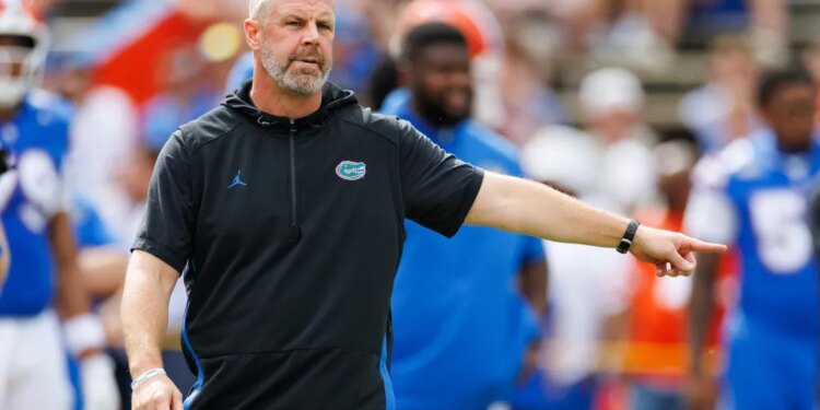 Florida Gators coach Billy Napier pointing on the field.