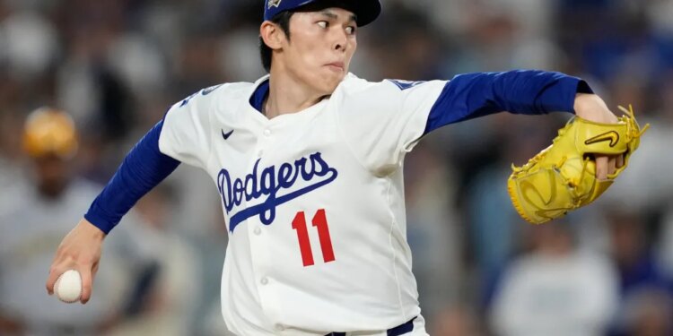 Los Angeles Dodgers pitcher Roki Sasaki throws a pitch during a game.