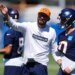 Denver Broncos quarterbacks coach Davis Webb directs quarterback Bo Nix during practice.