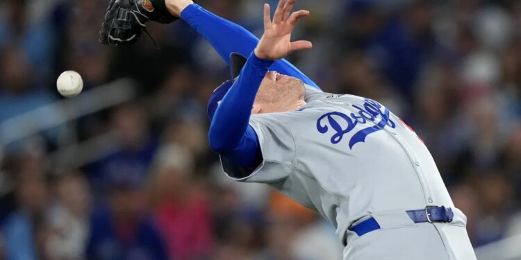 Los Angeles first baseman Freddie Freeman drops a pop up during the second inning of Game 2 of the World Series between the Dodgers and Blue Jays.