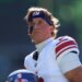 New York Giants quarterback Jaxson Dart (6) looking on before a game.