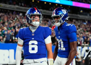 Jaxson Dart and Beaux Collins of the New York Giants celebrate a touchdown.
