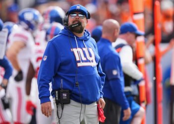 Giants head coach Brian Daboll watches from the sideline during the first half of an NFL football game against the Denver Broncos in Denver, Sunday, Oct. 19, 2025.