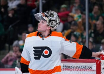 Philadelphia Flyers goaltender Carter Hart waits for play to resume during the third period of an NHL hockey game against the Minnesota Wild, Thursday, Jan. 26, 2023, in St. Paul, Minn.