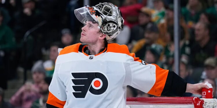 Philadelphia Flyers goaltender Carter Hart waits for play to resume during the third period of an NHL hockey game against the Minnesota Wild, Thursday, Jan. 26, 2023, in St. Paul, Minn.