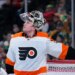 Philadelphia Flyers goaltender Carter Hart waits for play to resume during the third period of an NHL hockey game against the Minnesota Wild, Thursday, Jan. 26, 2023, in St. Paul, Minn.
