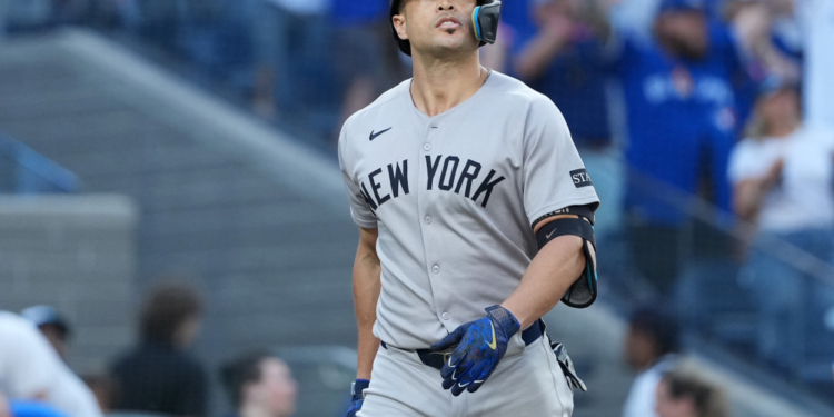 New York Yankees designated hitter Giancarlo Stanton reacts after striking out.