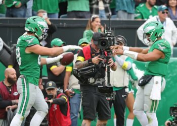 Philadelphia Eagles tight end Dallas Goedert #88 celebrates with Philadelphia Eagles quarterback Jalen Hurts #1 after he scores a touchdown during the fourth quarter.