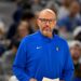 A male coach in a blue Dallas Mavericks jacket with a Nike swoosh.