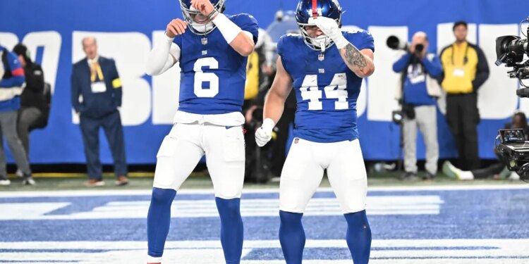 Jaxson Dart (L.) and Cam Skattebo celebrate during the Giants-Eagles game on Oct. 9, 2025.