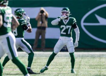 Malachi Moore #27 of the New York Jets rects after he tackles Jimmy Horn Jr. #15 of the Carolina Panthers stoping a completion during the 2nd quarter at MetLife Stadium, Sunday, Oct. 19, 2025, in East Rutherford, NJ.