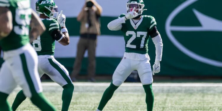 Malachi Moore #27 of the New York Jets rects after he tackles Jimmy Horn Jr. #15 of the Carolina Panthers stoping a completion during the 2nd quarter at MetLife Stadium, Sunday, Oct. 19, 2025, in East Rutherford, NJ.
