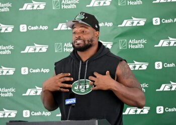 Jets guard John Simpson speaks to the media before practice at training camp in Florham Park, N.J.