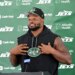 Jets guard John Simpson speaks to the media before practice at training camp in Florham Park, N.J.