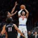 Knicks guard Josh Hart (3) shoots the basketball over Miami Heat guard Dru Smith (12) and forward Jaime Jaquez Jr. (11) during the third quarter at Kaseya Center.