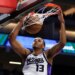 Sacramento Kings forward Keegan Murray dunks the ball during the first half of an NBA basketball preseason game against the Toronto Raptors, Wednesday, Oct. 8, 2025, in Sacramento, Calif.