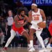New York Knicks forward Guerschon Yabusele #28 looks for an opening as Washington Wizards Marvin Bagley III defends during the first quarter.