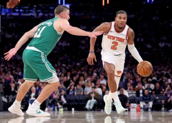 Miles McBride, who was placed in the starting lineup and scored 10 points, dribbles up court as Payton Pritchard defends during the Knicks' 105-95 win over the Celtics at the Garden on Oct. 24, 2025.