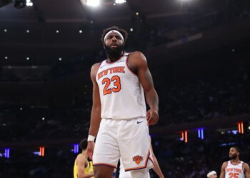 New York Knicks center Mitchell Robinson #23 reacts on the floor during the third quarter.