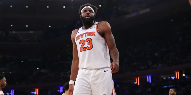 New York Knicks center Mitchell Robinson #23 reacts on the floor during the third quarter.