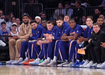 New York Knicks center/forward Karl-Anthony Towns #32 on the bench during the first quarter.