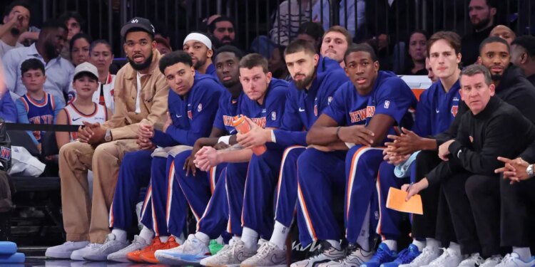 New York Knicks center/forward Karl-Anthony Towns #32 on the bench during the first quarter.