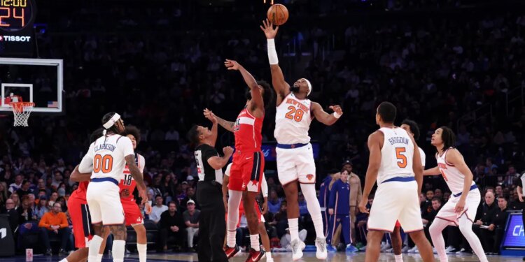 Guerschon Yabusele wins the opening tip of Monday night's preseason game against the Wizards.
