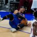 New York Knicks' Josh Hart reacts as he falls during the first half of an NBA preseason basketball game against the Philadelphia 76ers, Thursday, Oct. 2, 2025, in Abu Dhabi, United Arab Emirates.