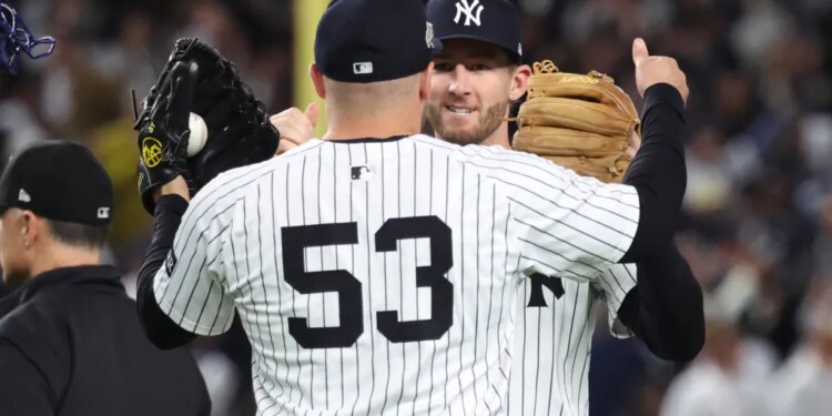 David Bednar #53 of the New York Yankees greets Ryan McMahon