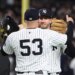 David Bednar #53 of the New York Yankees greets Ryan McMahon