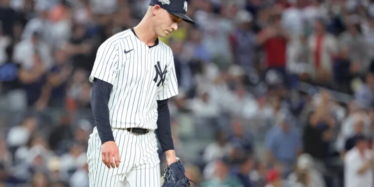 New York Yankees pitcher Luke Weaver reacts after giving up a two-run single.