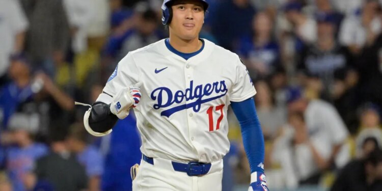 Los Angeles Dodgers designated hitter Shohei Ohtani (17) reacts after flying out against the Cincinnati Reds in the fourth inning during game two of the Wildcard round for the 2025 MLB playoffs at Dodger Stadium.