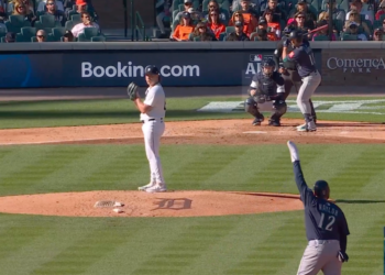 Josh Naylor waved his arms while on second base for the Mariners on Oct. 8, 2025.