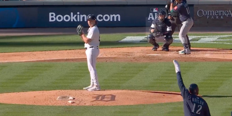 Josh Naylor waved his arms while on second base for the Mariners on Oct. 8, 2025.