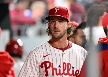 Philadelphia Phillies player in uniform, wearing a red cap.