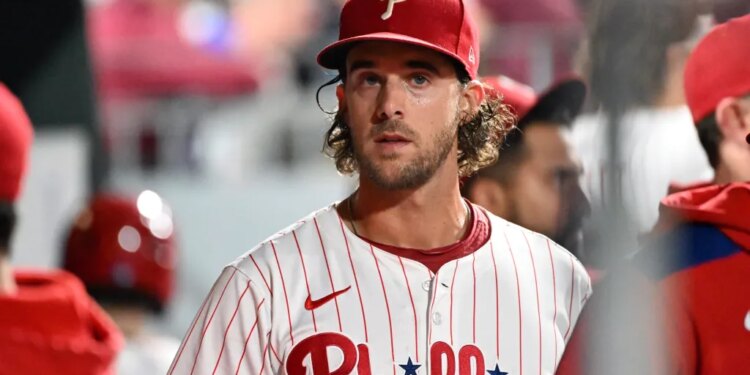 Philadelphia Phillies player in uniform, wearing a red cap.